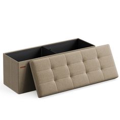 an upholstered couch with two compartments for storage