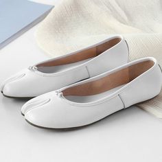 Depicted on the front of these leather ballerina shoes, this slip-on pair is both unique and versatile. Style: Ballet Flats Upper Material: Calf Leather Shoe Width: Standard Type: Flat Department: Women Toe Shape: Splite toe Occasion: Casual Leather Slip-on Ballet Flats For Spring, White Flat Pointed Toe Flats For Spring, White Pointed Toe Flats For Spring, Slip-on Ballet Flats With Stitched Sole, Spring Slip-ons With Stitched Sole And Almond Toe, Spring Slip-on Leather Shoes With Flat Heel, Spring Closed Toe Slip-ons With Stitched Sole, Spring Ballet Flats With Rubber Sole And Round Toe, Spring Ballet Flats With Rubber Sole And Closed Toe