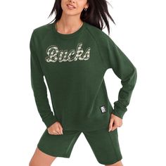 Cooler weather calls for the comfy fit and feel of this Regina sweatshirt from DKNY Sport. It features a repeating pattern on the Milwaukee Bucks graphics and soft material in a team color. Raglan sleeves also allow you to move your arms more freely in this Milwaukee Bucks pullover. Crew neck Embroidered fabric applique Pullover French terry lining Officially licensed Machine wash, tumble dry low Material: 60% Cotton/40% Polyester Raglan sleeves Imported Long sleeve Brand: DKNY Sport Midweight s Milwaukee Bucks Logo, Bucks Logo, Raglan Pullover, Fabric Applique, Milwaukee Bucks, Embroidered Fabric, Comfy Fits, Hunter Green, Team Colors