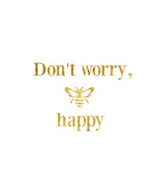 the words don't worry, happy written in gold foil on a white background