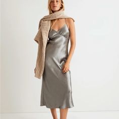 Crafted Of Luxe Recycled Metallic Satin Woven With Eco-Friendly Lenzing Ecovero Fibers, This Fan-Favorite Midi Slip Dress Drapes Beautifully On The Body. With Thin Cami Straps, A Sexy V-Neckline And Angular Seaming At The Bust, It's The Perfect One-And-Done Party Piece, Or Wear It Layered For An Easy Pared-Down Moment. Body-Skimming Fit. Falls 52" From High Point Of Shoulder (Based On Size 6). 100% Polyester (50% Of Which Is Recycled). Do Well: Made From Polyester Recycled From Materials That Could Otherwise Go To Landfills. Dry Clean. Imported. Item No120 Dress Drape, Midi Slip Dress, Wrap Midi Dress, Tiered Midi Dress, Madewell Dresses, Dress Satin, Satin Slip Dress, Tee Dress, Gray Dress