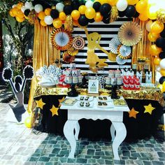 a party table with balloons and decorations