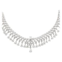 Exquisite vintage diamond layout necklace. 29.58 carats of round brilliant, pear, and marquise cut diamonds. Approximately G/H color and VS2/SI1 clarity. 18k white gold, 16in. Accommodated with an up-to-date appraisal by a GIA G.G. once purchased, upon request. Please contact us with any questions. Item Number N6389 Modern Diamond Jewelry, Bridal Diamond Necklace, Drop Necklaces, Diamond Drop Necklace, Pearl Drop Necklace, Diamond Tennis Necklace, White Gold Necklace, Round Necklace, Royal Jewels