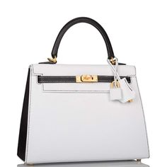 Luxury White Bags With Turn-lock Closure, Luxury White Bag With Turn-lock Closure, Timeless White Bag With Turn-lock Closure, White Timeless Epsom Leather Bag, Timeless White Epsom Leather Bag, White Epsom Leather Bag With Palladium Hardware, Top Handle Bags In Epsom Leather With Lock, Top Handle Epsom Leather Bag With Lock, Elegant White Bag With Lock