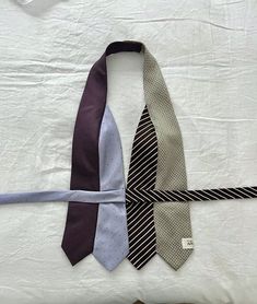 three ties laid out on top of each other