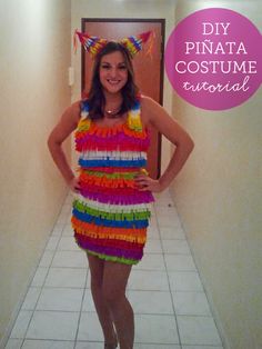 a woman standing in a hallway wearing a dress made out of pinata - cost