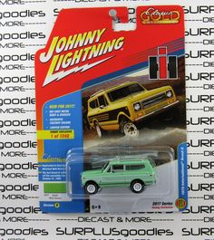 the green truck is on display for people to see in this toy car advertises johnny lightning