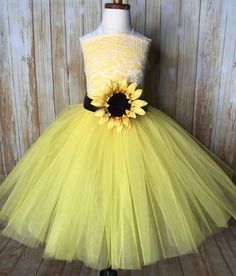 a yellow dress with a sunflower on it