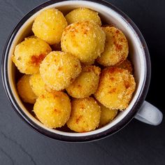 a bowl filled with fried food on top of a table