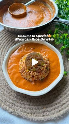 two bowls filled with food on top of a table