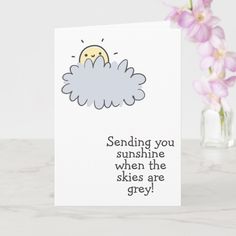 a greeting card with an image of a cloud and the words sending you sunshine when the skies are grey