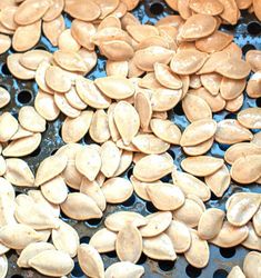 pumpkin seeds are being cooked on the grill