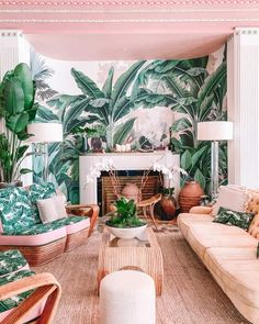 a living room filled with lots of furniture next to a fire place covered in plants