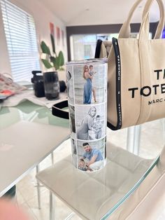 a tote bag sitting on top of a glass table