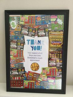 a basketball themed thank you card is displayed in a black frame on a white shelf