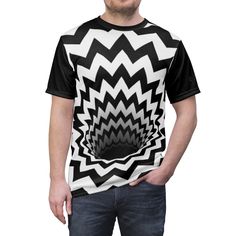 Optical Illusion Black Hole Chevron Zig Zag (Black/White) - Unisex AOP T-Shirt This Optical Illusion Black Hole Chevron Zig Zag (Black/White) print by BJORLIE will make you do a double-take! This black and white graphic print featuring a mysterious portal will  transport you into a whole new dimension of fashion. Uniquely textured, thick microfibre knit fabric of this high quality T-shirt wicks perspiration rapidly away from the skin, drawing it to the surface where it quickly evaporates. A styl Casual Black Sublimation T-shirt With Graphic Print, Black Graphic Design Short Sleeve Top, Black Graphic Short Sleeve Top, Black Short Sleeve Top With Graphic Design, Casual Black Sublimation Design With All Over Print, Casual Black Sublimation Design With Graphic Print, Casual Black Sublimation Shirt With Graphic Print, Black Tops With All Over Print And Short Sleeves, Black Graphic Tee With All Over Print