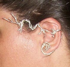 a person with some kind of ear piercing