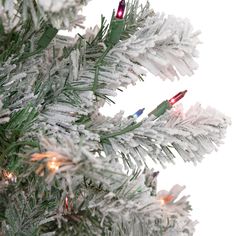 a white christmas tree with red and blue lights on it's branches, in front of a white background