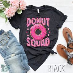 a donut squad shirt with pink sprinkles on it