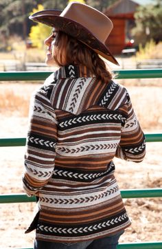 This Cruel Denim Women's brown-hued Aztec Shirt Jacket begs to be swooned over - with its polyester tweed fabric and faux leather piping trim on the yoke and pockets, it's a Western-style work of art. The Concho button snaps and soft polyester lining make this jacket a classic piece, sure to show off your style while keeping you feeling cozy and contented! Shell - 100% Polyester Trim - 100% Polyurethane Pocket /Lining: 100% Polyester Machine Wash Cold -Turn inside out Gentle Cycle Tumble Dry low Aztec Shirt, Cruel Girl, Western Clothing, Western Store, Cowgirl Western, Western Hats, Tweed Fabric, Trucker Jacket, Cowgirl Boots