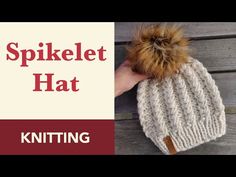 a knitted hat with a pom - pom on top and text that reads spielt hat knitting