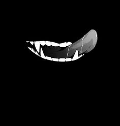 an animal's mouth is shown in the dark, with teeth and fangs on it