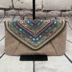 Chico's Jerri Clutch Embellished Embroidered Chain Bag Turquoise Tan Nwt. Good Condition No Noticeable Flaws Bohemian Multicolor Embellished Clutch, Bohemian Embellished Clutch For Festive Occasions, Bohemian Green Embellished Bag, Green Embellished Bohemian Bags, Bohemian Embellished Clutch Shoulder Bag, Green Bohemian Bag, Silk Wool, Chain Bag, Tag Sale