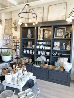 a room filled with lots of different items on top of shelves next to each other