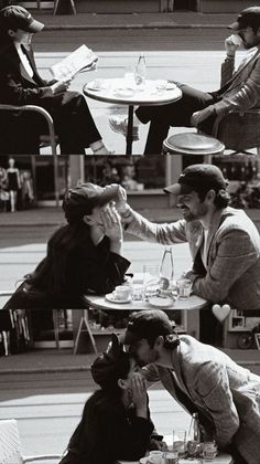 black and white photograph of people sitting at tables eating food in an outdoor cafe area