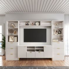 a white entertainment center with shelves and a flat screen tv mounted on it's side