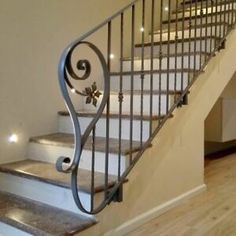 a staircase with metal handrail and stone steps