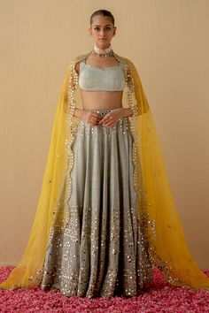 Yellow Organza Sets With Mirror Work, Yellow Lehenga With Sheer Dupatta In Chinon, Yellow Embellished Choli For Eid, Eid Embellished Yellow Choli, Eid Yellow Embellished Choli, Bollywood Style Embellished Yellow Dupatta, Traditional Drape Lehenga With Sequins In Chanderi, Chanderi Lehenga With Sequins, Unstitched, Traditional Drape Chanderi Lehenga With Sequins