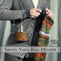 a woman is holding a ball of yarn and knitting it with the words swivel yarn ball holder