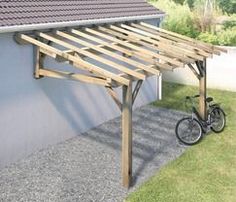 a bike parked under a wooden structure next to a house