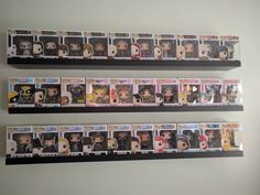 two wall shelves filled with different pop vinyls