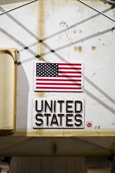 the united states sticker is on the side of a building with an american flag