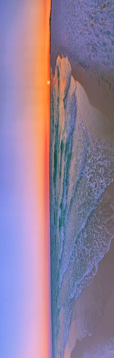 an aerial view of the ocean and beach