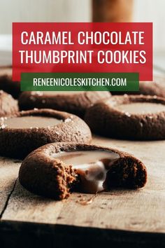 chocolate thumbprint cookies on a cutting board with the words caramel chocolate thumbprint cookies