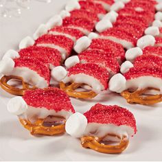 some pretzels are covered in red and white frosting