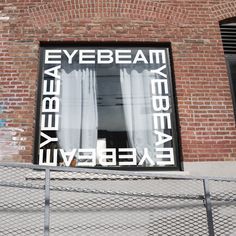 a brick building with a window that says yebeaem