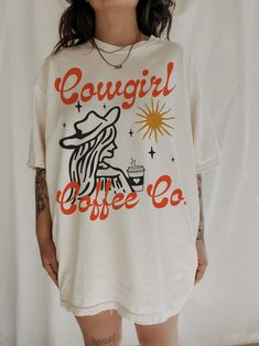 Cowgirl Coffee Co Tee – We The Babes Comfortable Graphic Print T-shirt, Trendy Relaxed Fit T-shirt For Loungewear, Relaxed Fit Screen Print T-shirt For Everyday, Oversized Graphic Print Tops For Loungewear, Graphic Print Ring-spun Cotton Top, Vintage Crew Neck T-shirt For Loungewear, Oversized Retro Cotton T-shirt, Trendy Oversized T-shirt With Front Print, Comfortable Graphic Print T-shirt For Streetwear