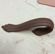 a close up of a chocolate object on a table