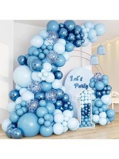 blue and white balloon arch for a baby's first birthday