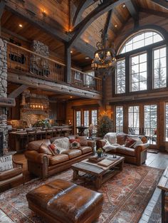 a living room filled with lots of furniture and windows