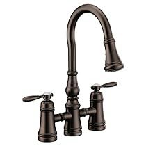 a faucet with two handles and nozzles is shown in this image