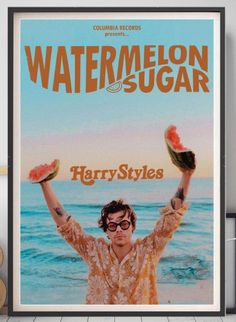 the poster for watermelon and sugar shows a man holding two slices of watermelon