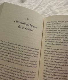 an open book with the words everything happens for a reason written in black on it