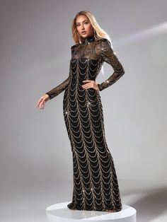 This Melisande Long Sleeve Sequin Maxi Dress In Black looks vibrant and captivating with its long sleeve striped sequin design atop a sheer mesh layer. Its maxi length creates a beautiful silhouette for any special occasion. Enjoy the confidence and sophistication of this stunning dress. Material: Sequin (100% Polyester) Invisible zipper opening at the back Clean: Hand wash cold Stretch Factor: Non Stretch Color may vary due to the lighting on images. The product images (without model) are the c Sequin Maxi Dress For Gala, Embellished Maxi Dress For Party, Long Evening Dress For Party, Gala Floor-length Contrast Sequin Maxi Dress, Floor-length Contrast Sequin Maxi Dress For Gala, Contrast Sequin Floor-length Maxi Dress For Gala, Glamorous Holiday Maxi Dress With Contrast Sequin, Sheer Long Sleeve Evening Dress For Gala, Sheer Long Sleeve Evening Dress For Night Out