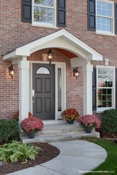 the front entrance to a brick house