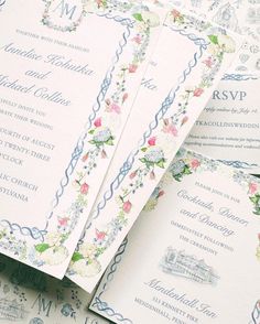 the wedding stationery is laid out on top of each other